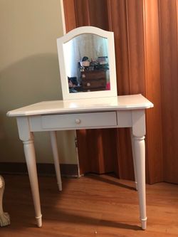 white table with a mirror