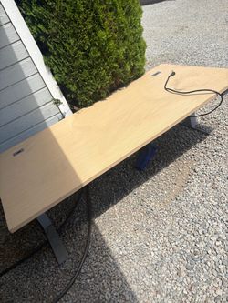 Electric table goes up and down with available outlets work table