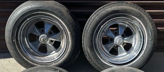 Two 14 inch Cal Chrome classic cragar style wheels with old tires