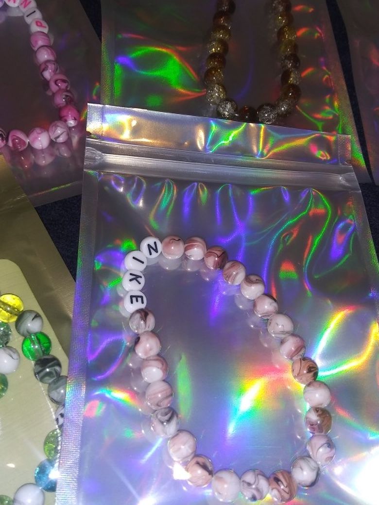 Nike. Pink. Bracelets