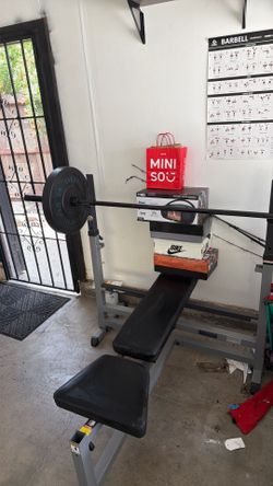 Bench press  2/45’s with bar adjustable