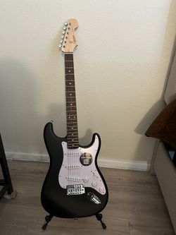 Squier Electric Guitar With Stand
