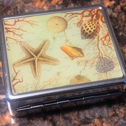 VINTAGE SHELLS STAINLESS STEEL PILL BOX B/O