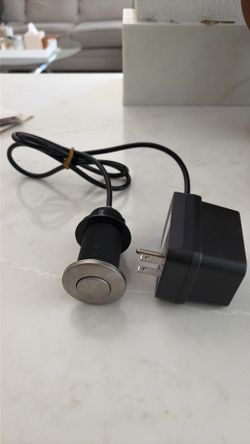 Brand new stainless steel garbage disposal button