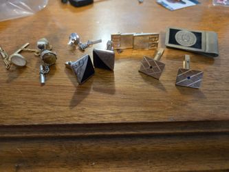 Assorted cuff links, tie tacks and money clip