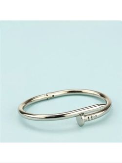 Silver colored nail bracelet