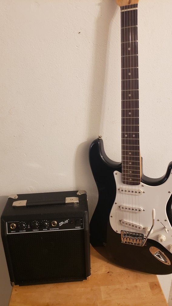 Electric Guitar Starcaster With Amplifier. 