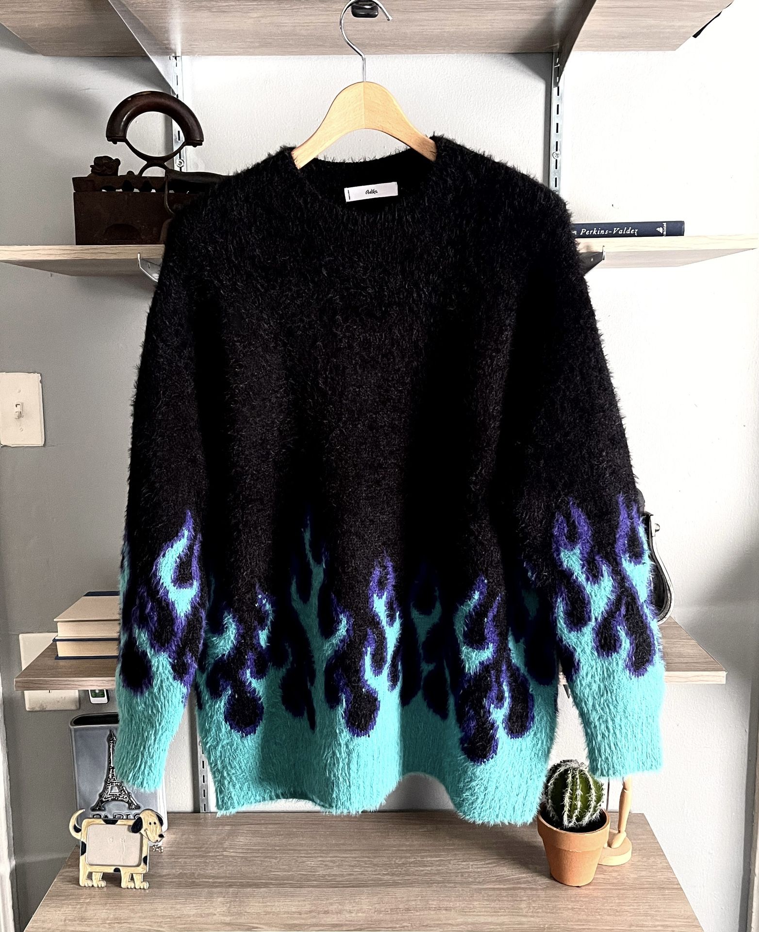 New! Women’s ADIKA “Slow Burn” Blue Flame Fuzzy Pullover Sweater. Size one size fits all. Retail $75. Oversized sweater. Color Black Teal Purple! Supe