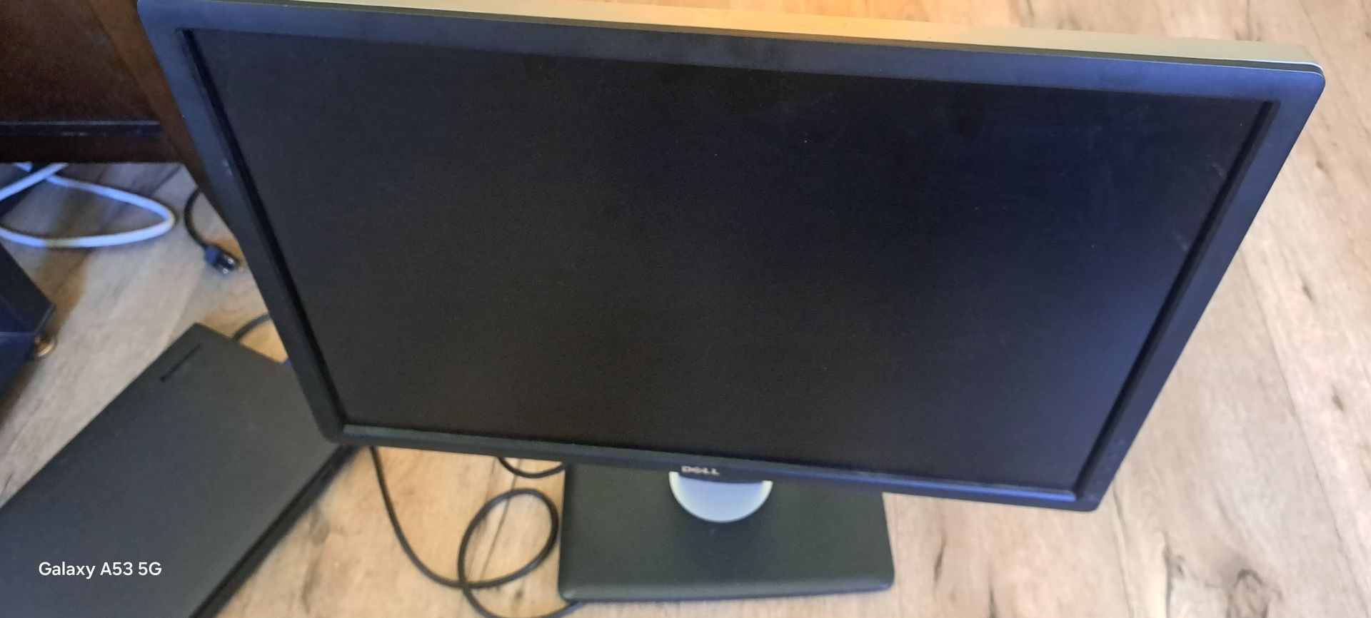 The image shows a Dell P-series monitor, likely models such as the P2419H, P1913, or the UltraSharp U2713HM.
