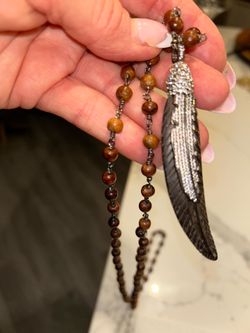 Wood beads and decorative feather necklace