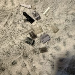 collection of grooming tool attachments and combs for a personal hair trimmer