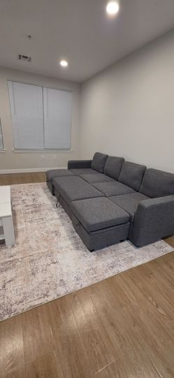 Almost new sectional/pull out sofa