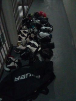 Hockey gear for two young boys ages 8 to 10 also soccer and baseball cleats