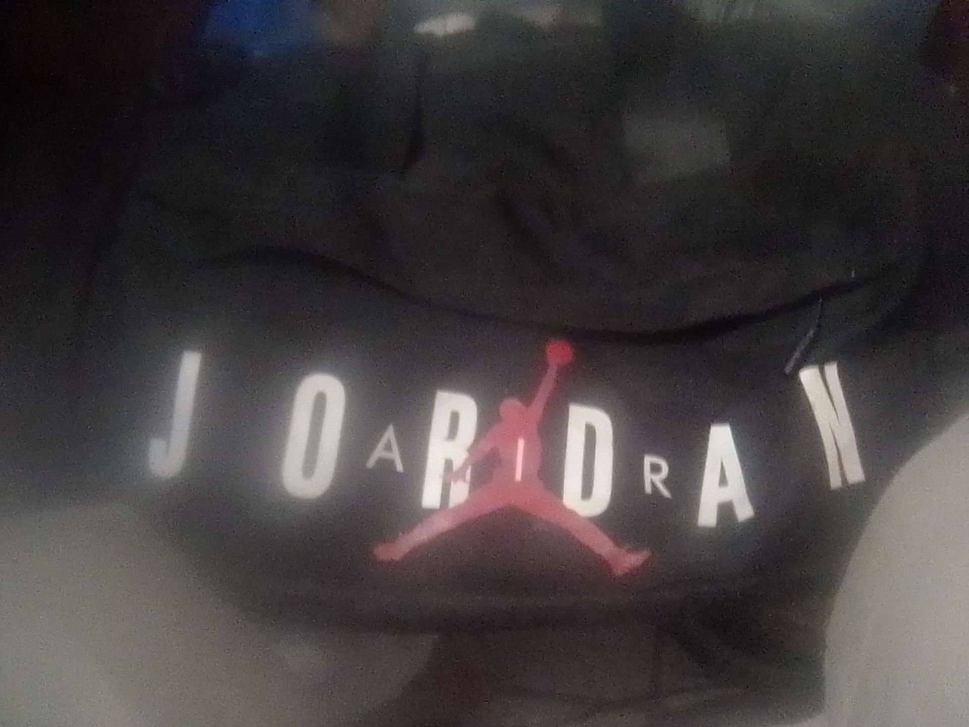 black Air Jordan bag, pockets inside and out and on the side convenience for workout at the gym or any normals of everyday life.