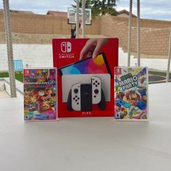 Nintendo Switch Oled with super Mario party and Mario kart deluxe 8 Floor Model 
