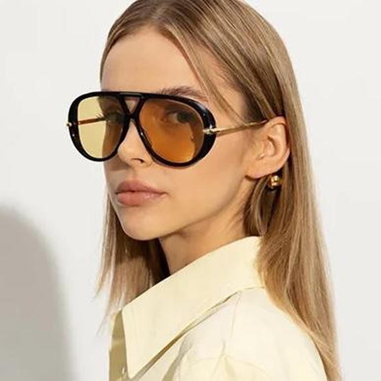 black aviator sunglasses with gold accents
