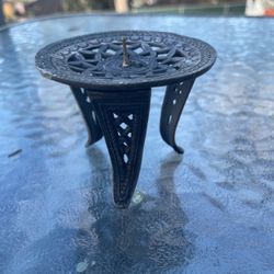 Gold colored metal candle holder stand