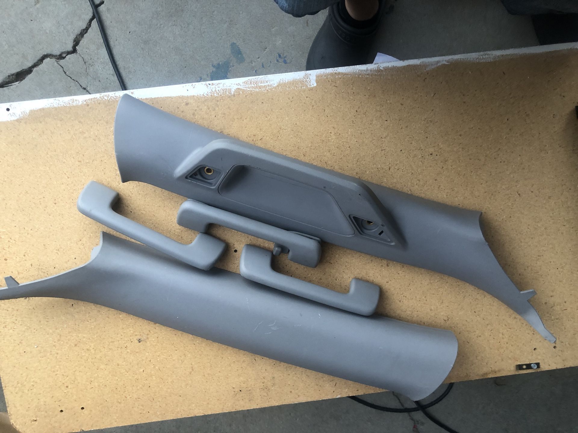 Interior left and right windshield trim with handle and three additional handles