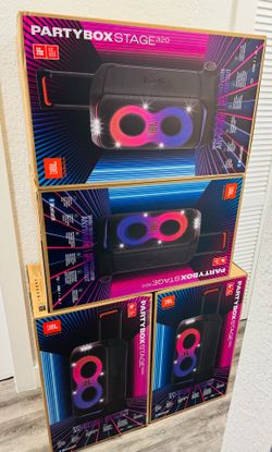 New JBL PartyBox Stage 320 portable speaker. This black unit has a telescopic handle and sturdy wheels for easy transport. It features a futuristic li