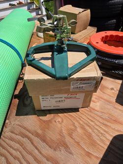 Aluminum slide base lawn sprinkler