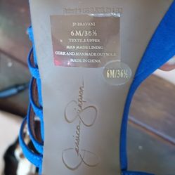 Elevate your style with these stunning Jessica Simpson platform sandals in ultra blue.