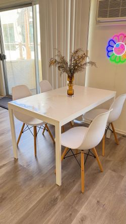 IKEA Ekedalen extendable dining table paired with 4 white mid-century modern shell chairs