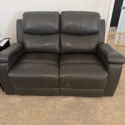 Binded leather love seat