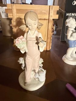 Porcelain Girl Figurine with Flowers and Bird
