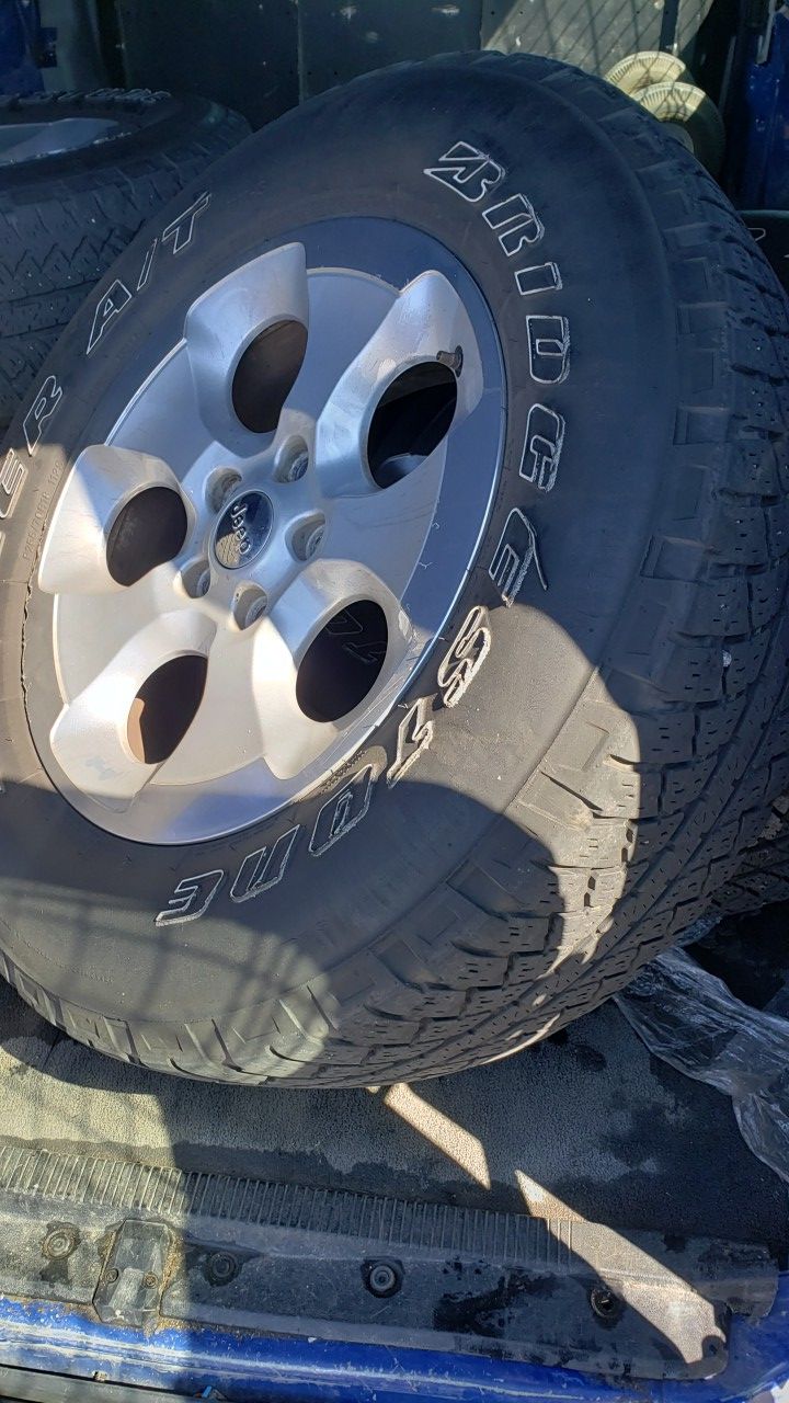 (5) jeep wrangler tires and rims wheels they are 18inch