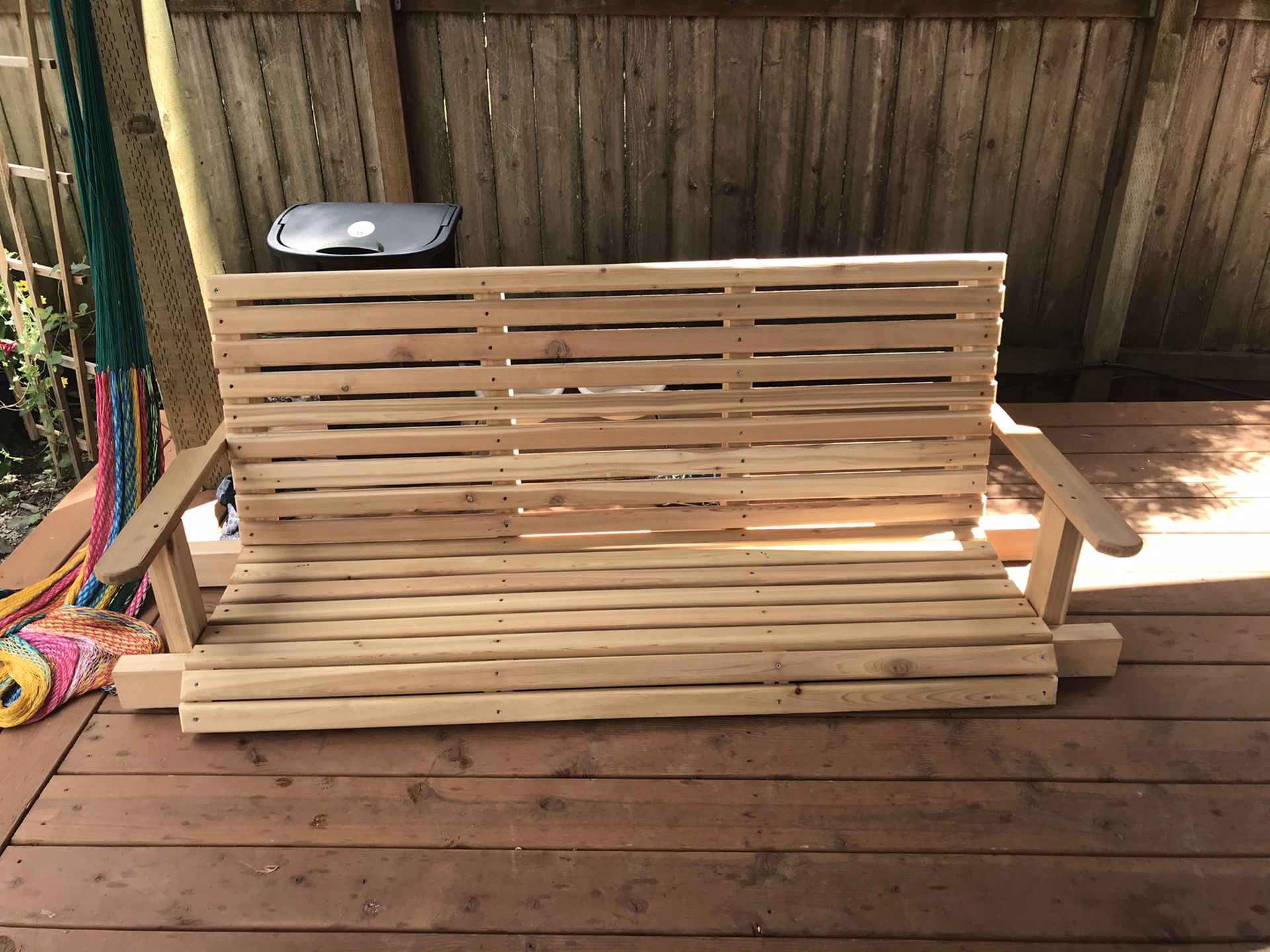 Handcrafted cedar porch swing