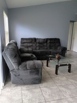 Dark gray sofa and loveseat