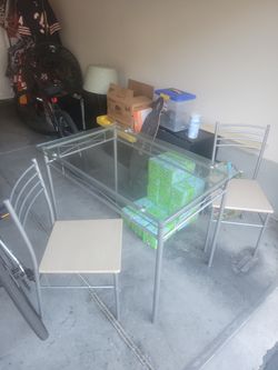 Glass table and two chairs