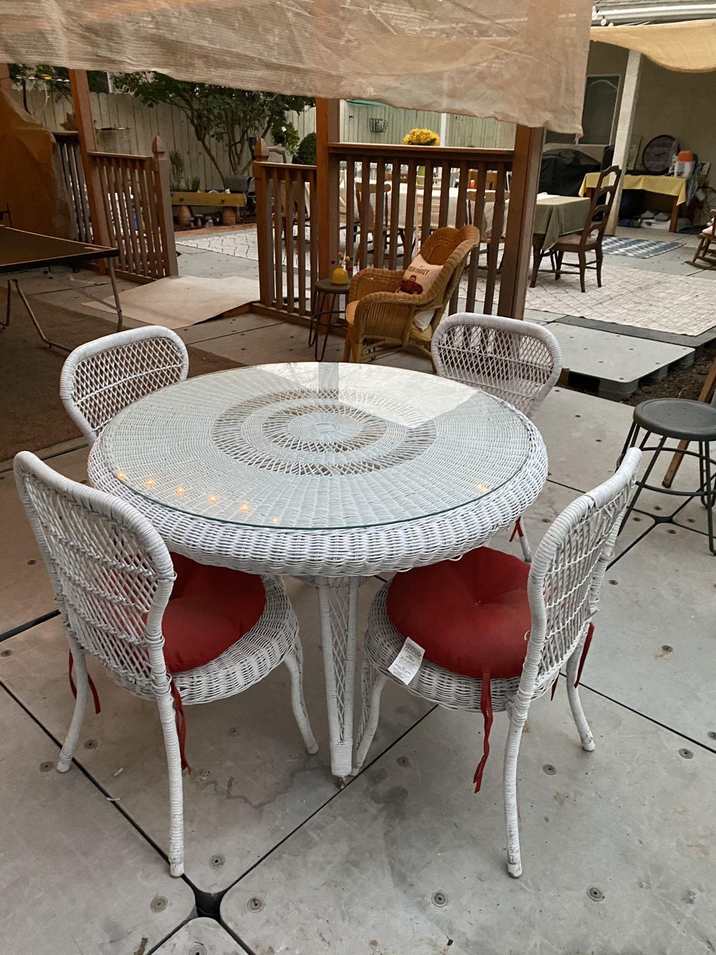 Wicker table and 4 chairs with glass top and new cushions