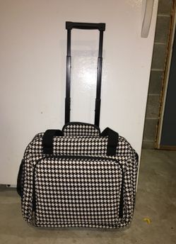 Carry on bag with wheels. Brand new.