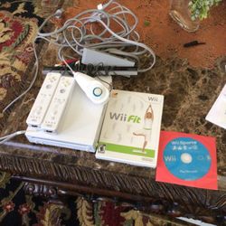  Nintendo Wii Two Controllers  One Nunchaku Two Games Works Very Good 
