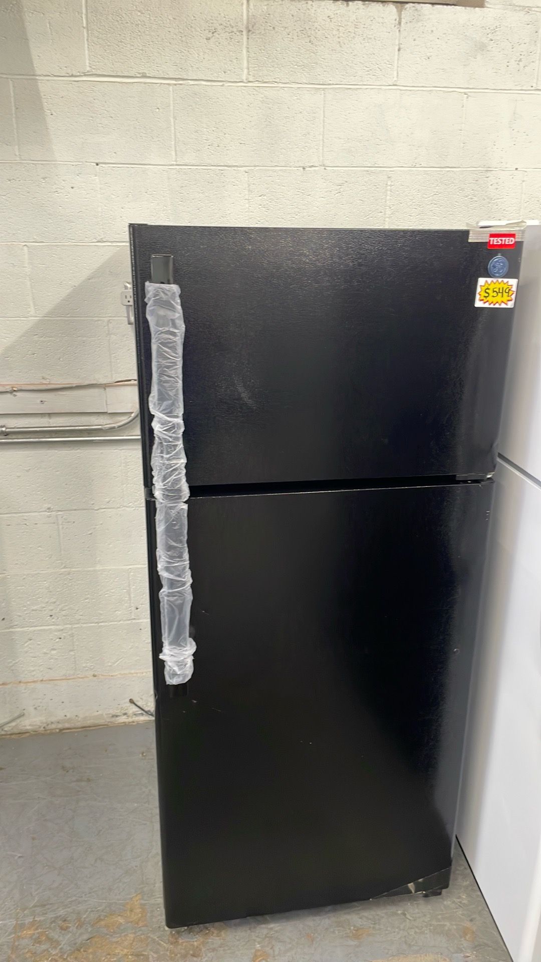 Ge New Black refrigerator top and bottom
