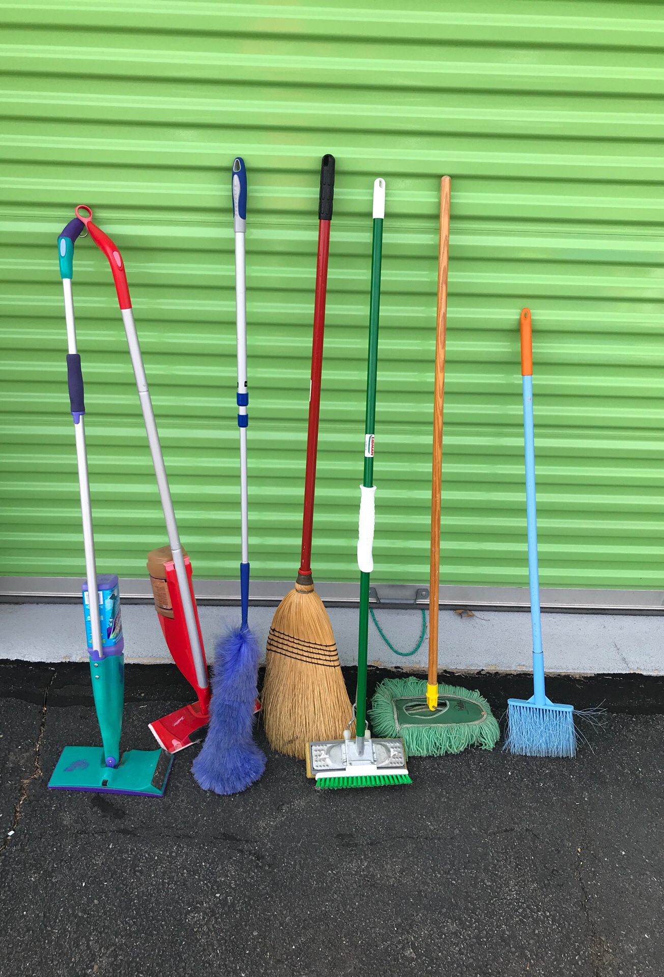 Misc lot of brooms mops and dusters