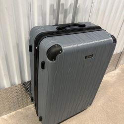 31” tall hard shell large luggage ..4 wheeled but missing 1 wheel but it works with remaining wheels