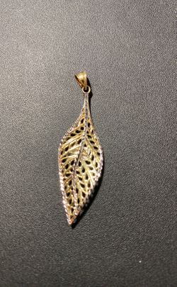 10k real solid gold pendant 1.75” and 1.4 gr