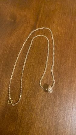 Gold chain with gold/diamond pendant