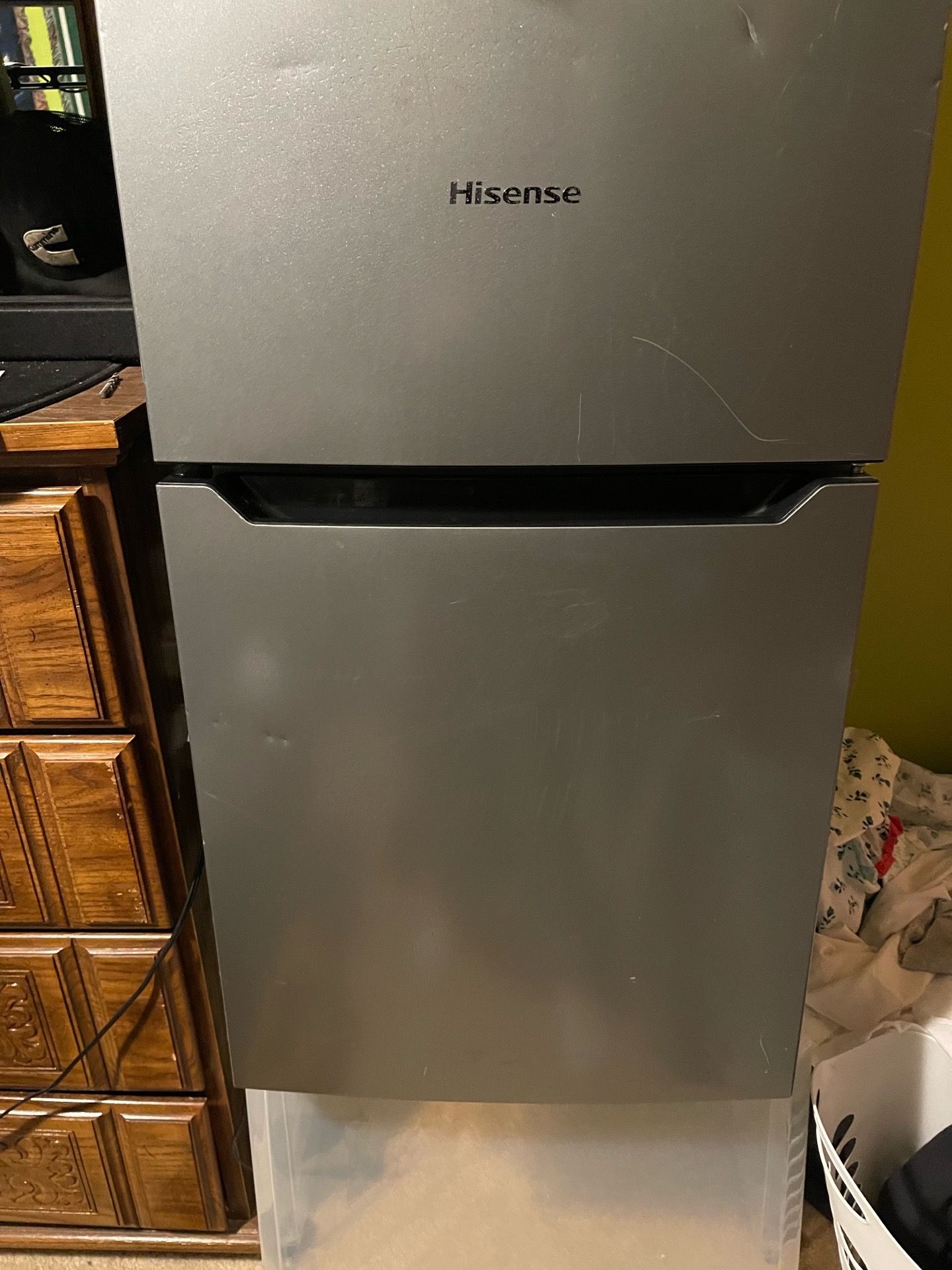 This is a Hisense stainless steel look compact mini fridge with a top freezer