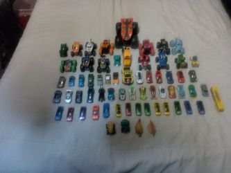 65 Original Hot wheels of various Sizes,  & Monster Trucks, Bat Mobile, Race Cars and Dinosaurs Cars,.