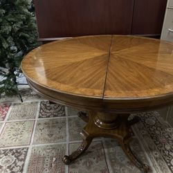Wooden Round Table with Unique Bottom Details 