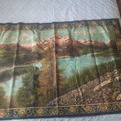 woven tapestry featuring a scenic mountain and lake landscape,