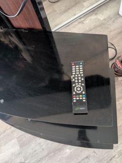 TV stand with TV and remote