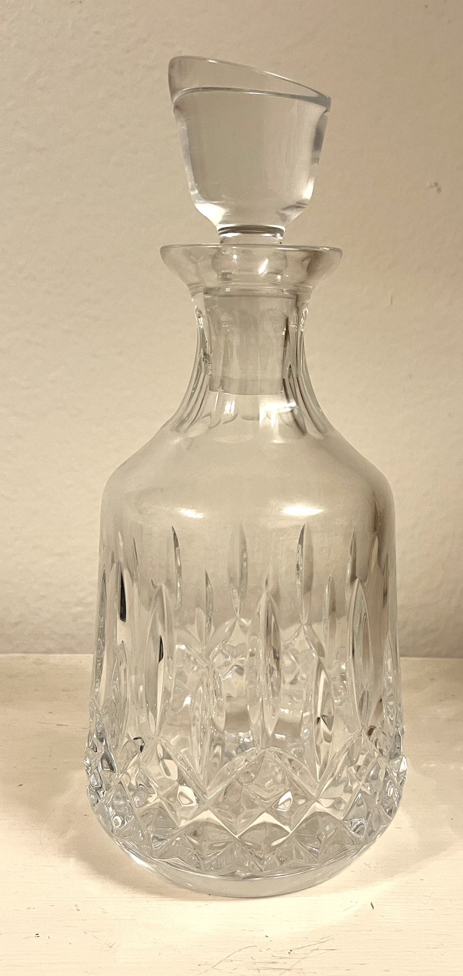 WATERFORD Lismore Decanter. Crystal pattern with signature diamond and wedge cuts. Slant cut on its crystal stopper. 
