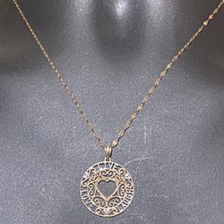 18 inch 10 karat delicate necklace with a 10 karat round pendant words lau laugh
