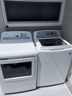 GE laundry machine, white 27 inch wide