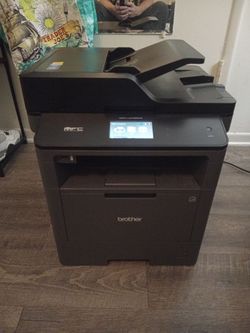 Monochrome laser all- in- one printer by Brother