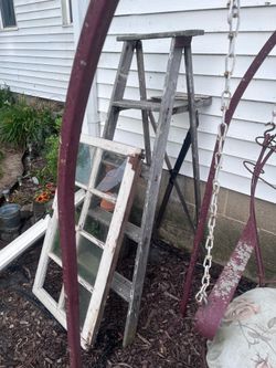 Wooden ladder and  vintage 8-pane window